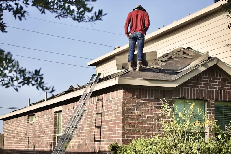 Professional roofer working on a residential roof in Bivalve